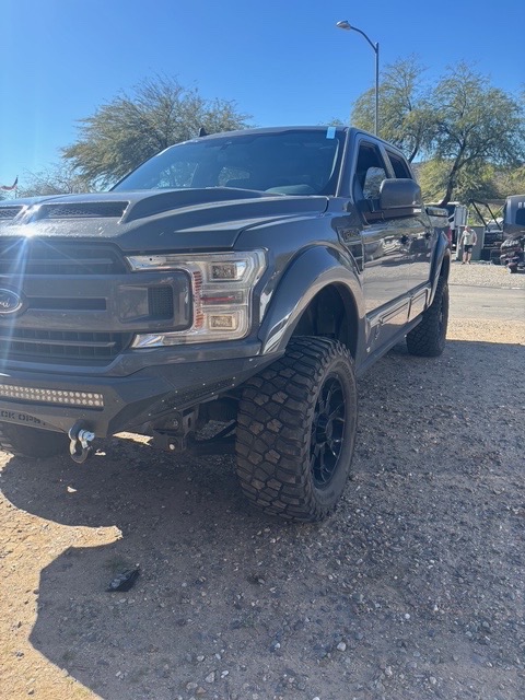 Auto glass service on lifted truck
